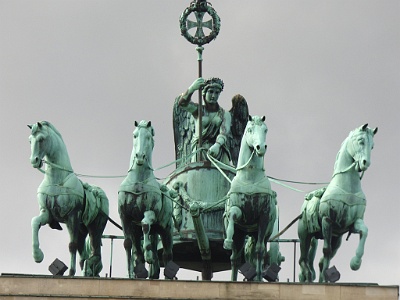 Brandenberg Gate  It is located in the western part of the city centre of Berlin within Mitte, at the junction of Unter den Linden and Ebertstraße, immediately west of the Pariser Platz. One block to the north stands the Reichstag building, which houses the German parliament (Bundestag). The gate is the monumental entry to Unter den Linden, the renowned boulevard of linden trees, which led directly to the royal City Palace of the Prussian monarchs.