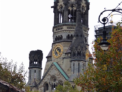 Kaiser Wilhelm Memorial Church  The Kaiser Wilhelm Memorial Church  is a Protestant church. The original church on the site was built in the 1890s. It was badly damaged in a bombing raid in 1943. The present building, which consists of a church with an attached foyer and a separate belfry with an attached chapel, was built between 1959 and 1963. The damaged spire of the old church has been retained and its ground floor has been made into a memorial hall.