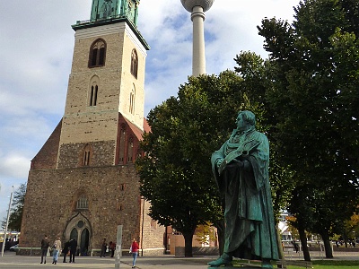 St. Mary's Church  There is a striking statue of Martin Luther outside the church. The Marienkirche also contains the tomb of Field Marshal Otto Christoph von Sparr. Carl Hildebrand Freiherr von Canstein, the founder of the oldest Bible society of the world, the Cansteinsche Bibelanstalt, was buried here in 1719.  After the war, this area was cleared of ruined buildings and today the church stands in the open spaces around the Alexanderplatz, and is overshadowed by the East Berlin television tower, the Fernsehturm