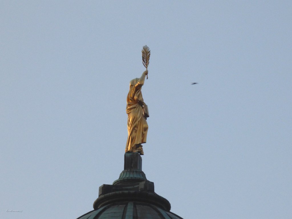 Statue on tower of French Dome in Gendarmenmarkt