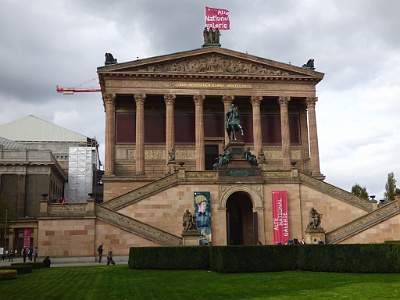 Old National Gallery  The building was designed by Friedrich August Stüler with details by Carl Busse, in an architectural style that is a mix between late Classicism and early Neo-Renaissance, and realised by Heinrich Strack. It was intended to express "the unity of art, nation, and history", and therefore has aspects reminiscent of a church (an apse) and a theatre (the grand staircase) as well as a temple.