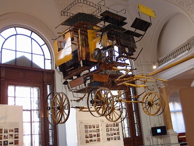 Museum of Communication  Individual pieces of  mail delivery wagon suspended by wire in the correct relative location to each other. (not supposed to take pictures.... shhhhh)