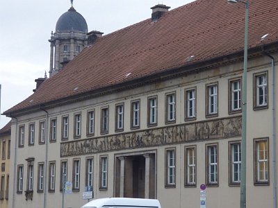 Former State Mint,  Berlin’s former State Mint, built in the 1930s, now operating as a venue for meetings & events.Alte Münze Berlin  The relief frieze based on models by Gilly and Schadow from the year 1800 shows scenes of metal and coin making in an antique style. The original of the frieze came after the demolition of the first Münzgebäudes on Werdersche Markt initially to a first new building of the coin on the Niederwallstraße. When this building was demolished for the Reichsbankneubau ( Haus am Werderschen Markt ), the frieze was stored and a copy made for the construction described here. In the 1960s, the Senate of West Berlin received the original of the frieze.