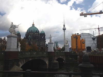 Schlossbrücke  Schlossbrücke is a bridge in the central Mitte district of Berlin, Germany. Built between 1821 und 1824 according to plans designed by Karl Friedrich Schinkel, it was named after the nearby City Palace (Stadtschloss). The bridge marks the eastern end of the Unter den Linden boulevard. Statues:   Athena Arms the Warrior (1851) Athena Leads the Young Warrior into the Fight (1853) Athena Protects the Young Hero (1854) Athena Teaches the Young Man How to Use a Weapon (1853) Iris Takes the Fallen Hero to Olympus (1857) Nike Assists the Wounded Warrior (1853) Nike Crowns the Hero (1853) Nike Instructs the Boy in Heroic History