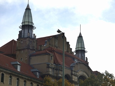 City Courthouse  The courthouse in Littenstraße - The architectural highlight of the building is the 30.5 meter high entrance hall on Littenstrasse with columns of red and green sandstone and with colored knight motifs on the ground floor and in the staircase. In the floor of the hall are still many of the original tiles with the crown as a royal emblem available. The overall style of the hall with the curved twin spiral staircases and the golden ornamentation of the ceiling formative style is the Art Nouveau style in an expression that is inspired by the Neo-Baroque.