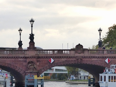 Moltke bridge  Moltke Bridge is a bridge over the Spree River in Berlin, Germany. Completed in 1891, it connects Alt-Moabit near the main railway station on the north bank to Willy-Brandt-Straße and the Chancellery on the south bank. The bridge is named after Field Marshal Helmuth von Moltke the Elder (1800–1891), chief of staff of the Prussian Army for thirty years. Moltke died just before the bridge's completion and it was inaugurated by his funeral cortege. The bridge has three crossed arches spanning the Spree made from red Main sandstone, decorated with statues of Johannes Boesen, Carl Piper and Carl Begas.