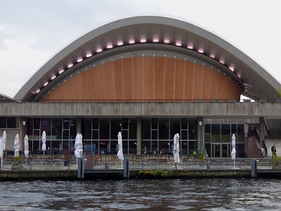 House of World Cultures  The House of World Cultures in Berlin is Germany's national centre for the presentation and discussion of international contemporary arts, with a special focus on non-European cultures and societies.  It was formerly known as the Kongresshalle conference hall, a gift from the United States, designed in 1957 by the American architect Hugh Stubbins as a part of the International Building Exhibition. Typical for Berlin popular humour, Berliners nicknamed it Die schwangere Auster ("The pregnant Oyster")