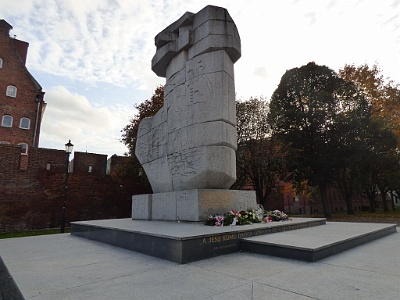 Monument to those who kept Gdańsk Polish  Unveiled in 1969 and designed by Wawrzyniec Samp and Wieslaw Pietron, this huge stone monument depicts an axe stuck in the ground and commemorates all those who gave their lives throughout the centuries (from the 1308 Gdańsk massacre to WWII) trying to maintain the Polish identity of Gdańsk.