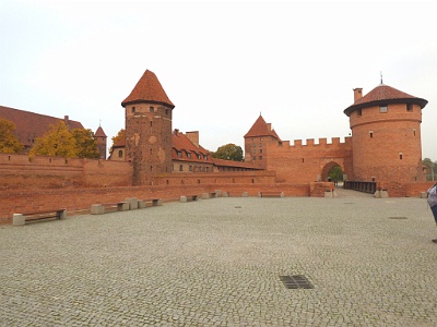 Malbork Castle  The castle is a classic example of a medieval fortress and, on its completion in 1406, was the world's largest brick castle.[3] UNESCO designated the "Castle of the Teutonic Order in Malbork" and the Malbork Castle Museum a World Heritage Site in December 1997.[4] It is one of two World Heritage Sites in the region with origins in the Teutonic Order. The other is the "Medieval Town of Toruń", founded in 1231 as the site of the castle Thorn.