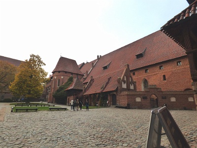 Malbork Castle  Middle Castle - The Grand Master's residence projected from the south-west angle of the Middle Castle. This shows the Grand Master’s Palace with St. Katherine’s Chapel, and the Knight’s Hall (right).