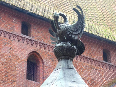 Malbork Castle  This sculpture represents a mother pelican feeding her chicks with here own blood, representative of Christ's sacrifice.